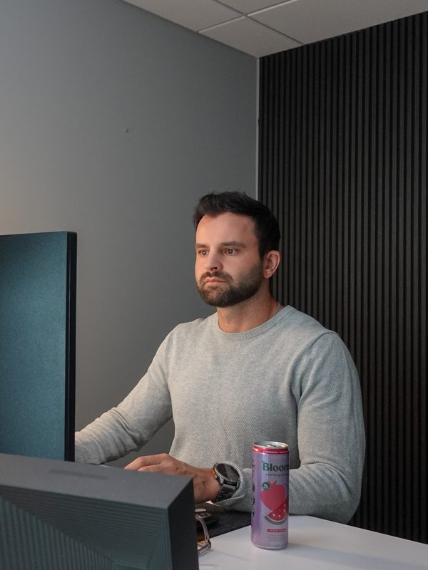 A Brokers Alliance team member working at a desk in the Fountain Hills office