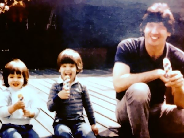 Joe Racich with his son and daughter on a deck, 1980s